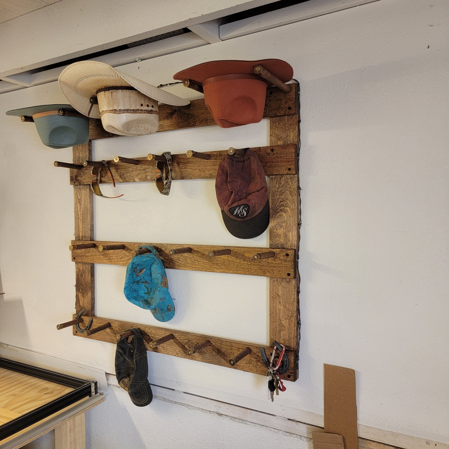 The Vertical Heavyweight: 3 Cowboy Hats + 13 Ball Caps