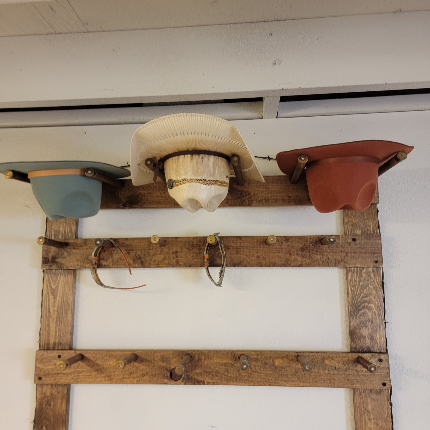 The Vertical Heavyweight: 3 Cowboy Hats + 13 Ball Caps