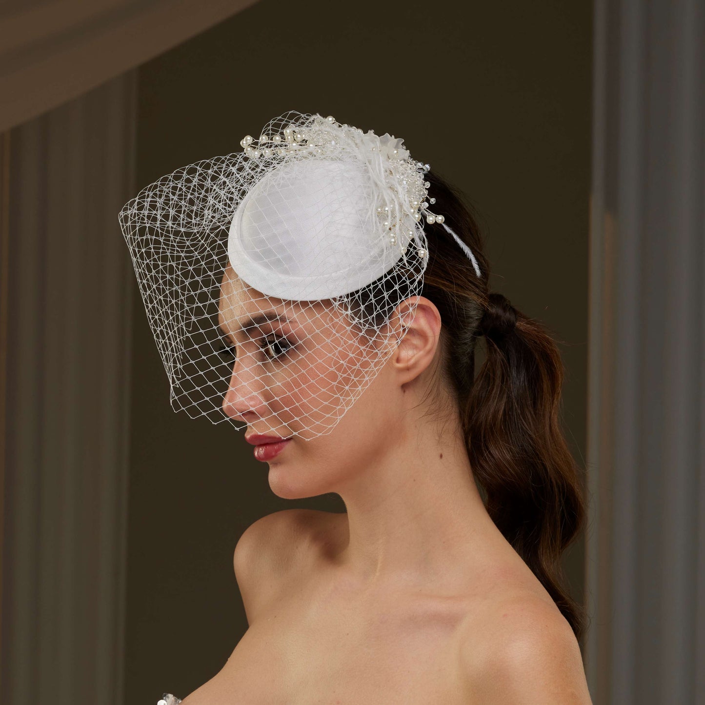 Elegant Bridal Fascinator with Birdcage Veil, Pearls & Feathers