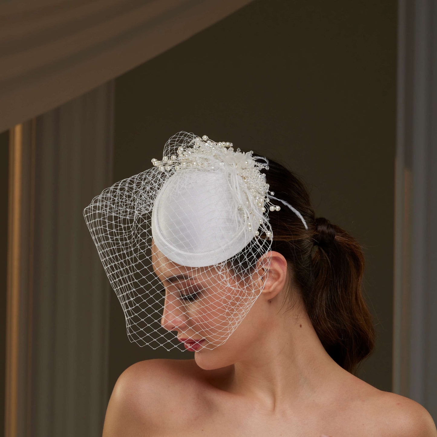 Elegant Bridal Fascinator with Birdcage Veil, Pearls & Feathers