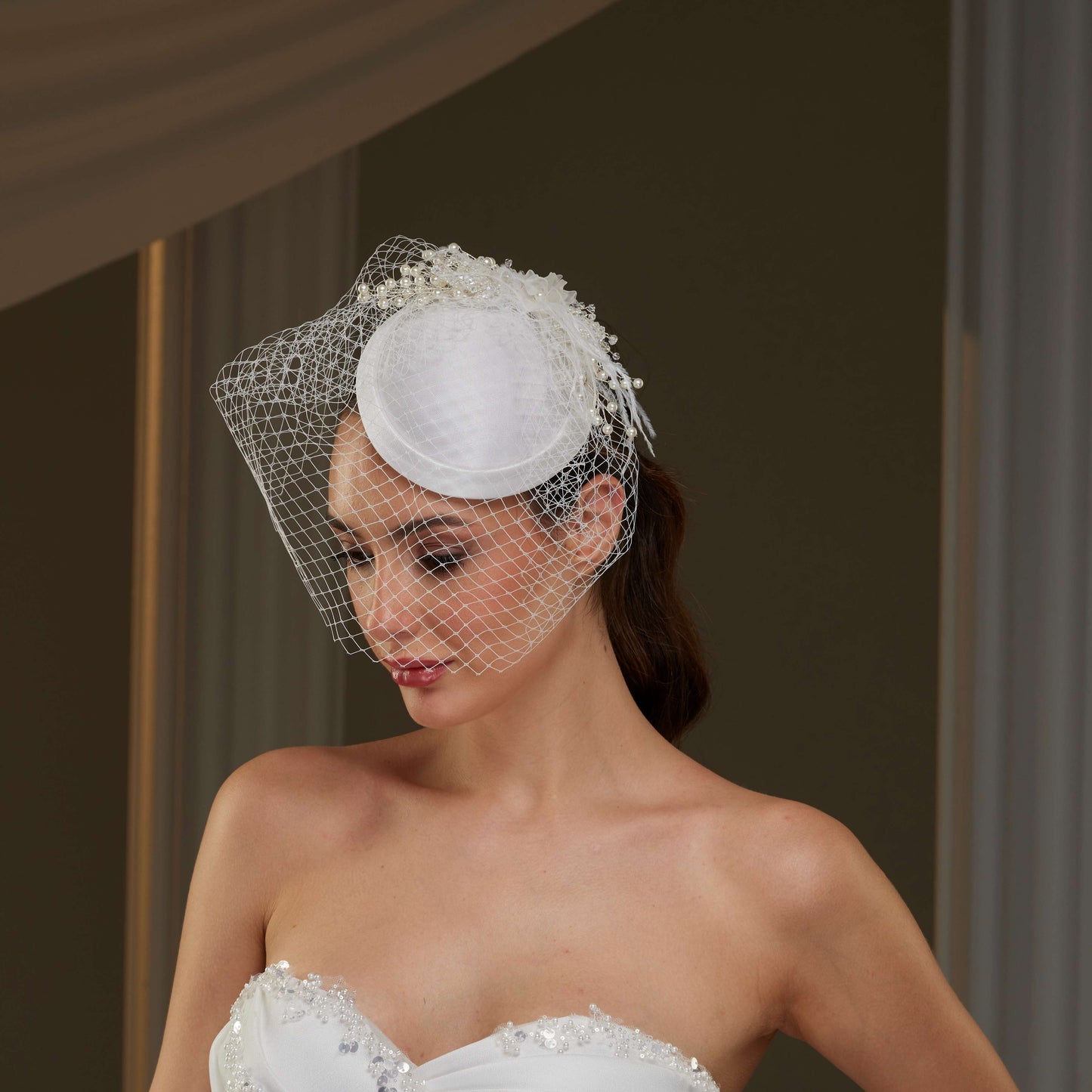 Elegant Bridal Fascinator with Birdcage Veil, Pearls & Feathers