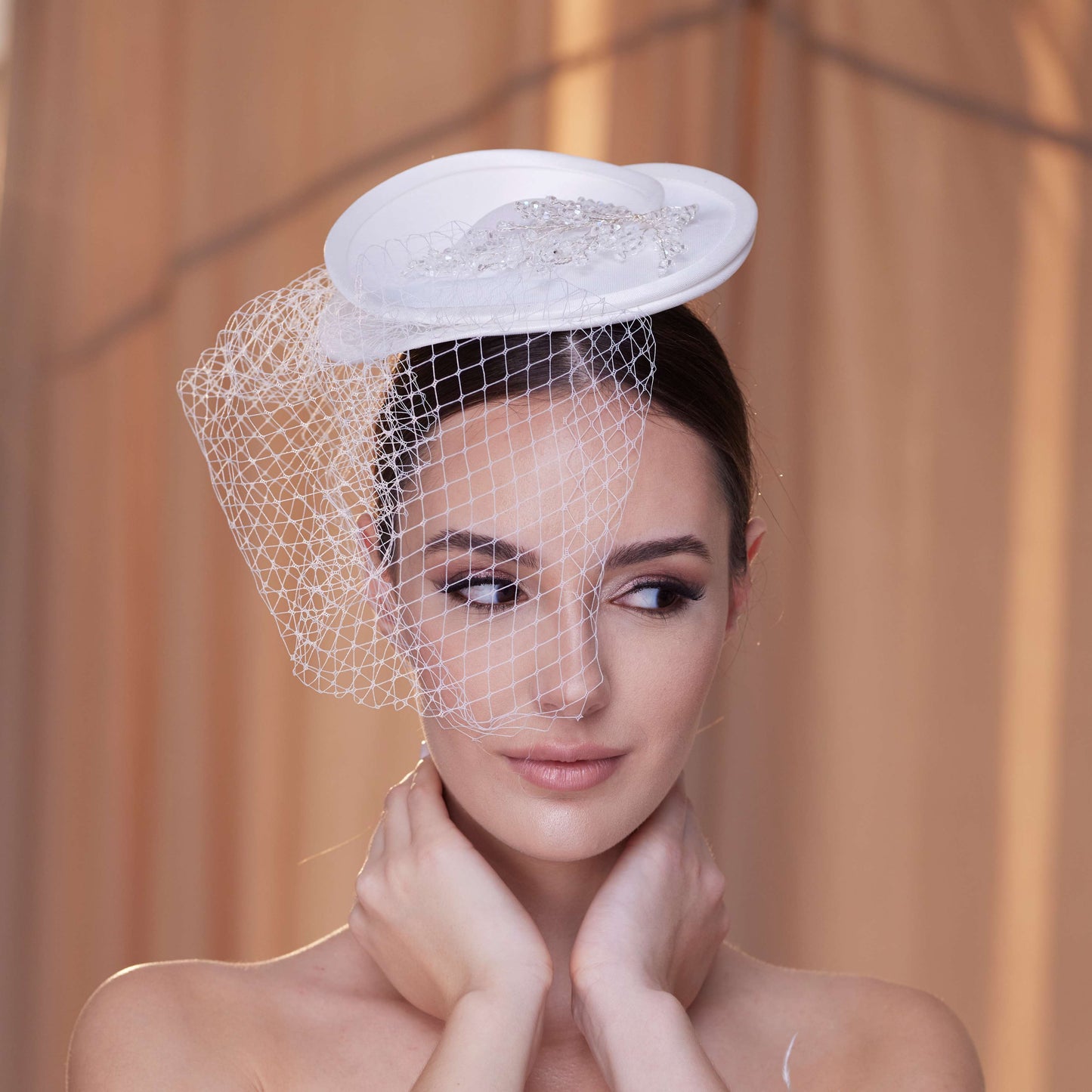 Elegant Bridal Fascinator with Beaded Details and Birdcage Veil
