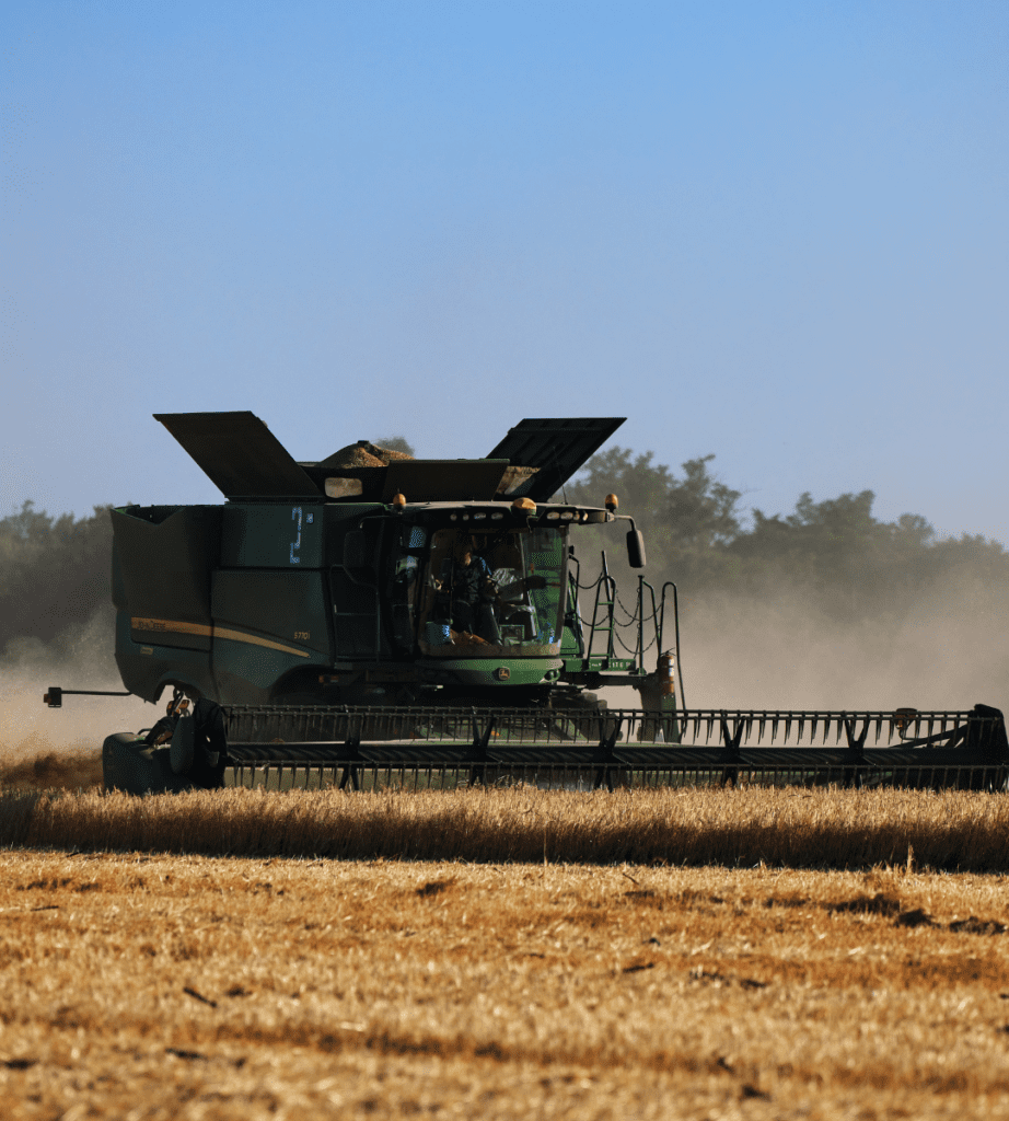 John Deere combine harvesting wheat