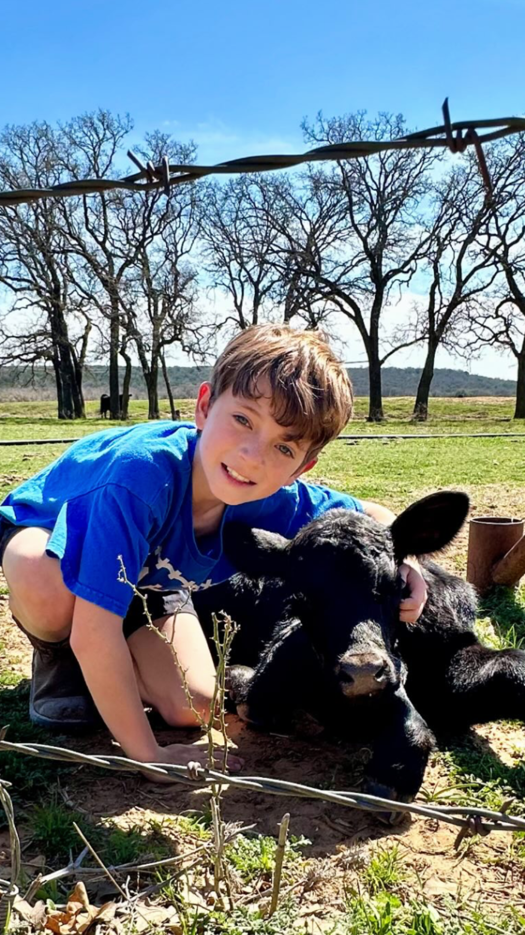 young boy with calves